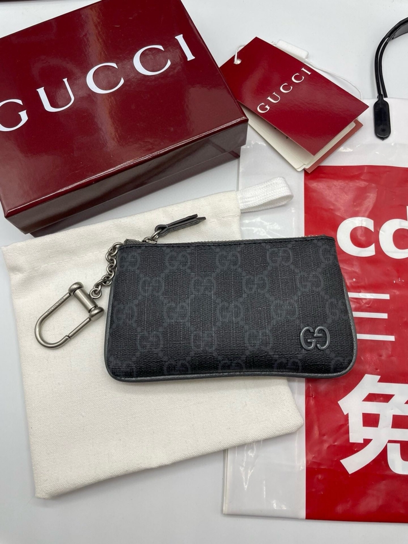 G*u*i clutch bags